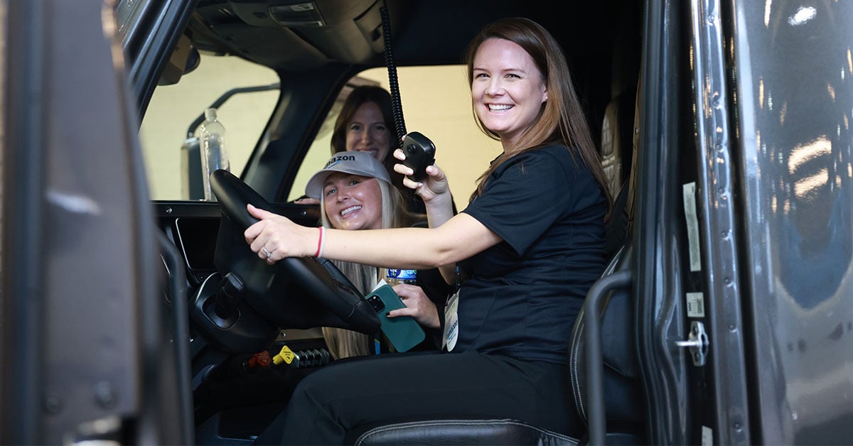 WIT-conference-2022-attendees-in-truck-cab-1200x628